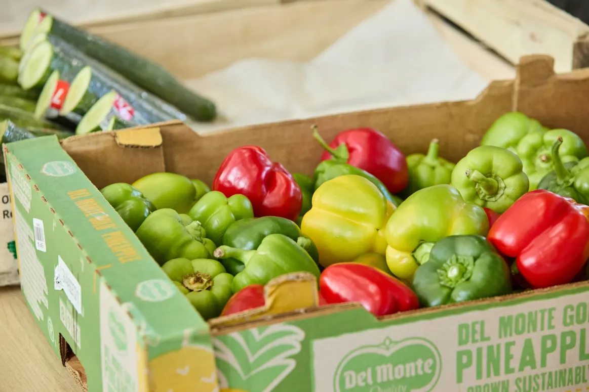 Fresh peppers in a cardboard container at the Bradfood foodbank