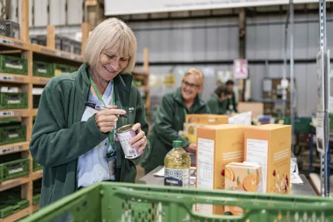 Foodbank volunteers packing food parcels.